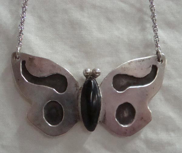 Hopi Sterling Overlay and Onyx Butterfly Choker: Native American Hopi Sterling Overlay and Onyx Butterfly Choker, hallmarked. 16'' chain and butterfly is 1.25''H x 2.25'' W. Nice work with some age.