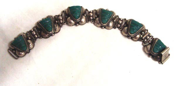 Jadeite Mayan Alpaca Silver Link Bracelets: Two Jadeite Mayan Alpaca Silver Link Bracelets. 1) 1.25''H x 6.5'' L Hallmarked ''Hecho in Mexico DPS'' 2) approx .75''H x 7''L. Mayan design on stones and little beads dangle. ''Hecho in Mexico'' sta