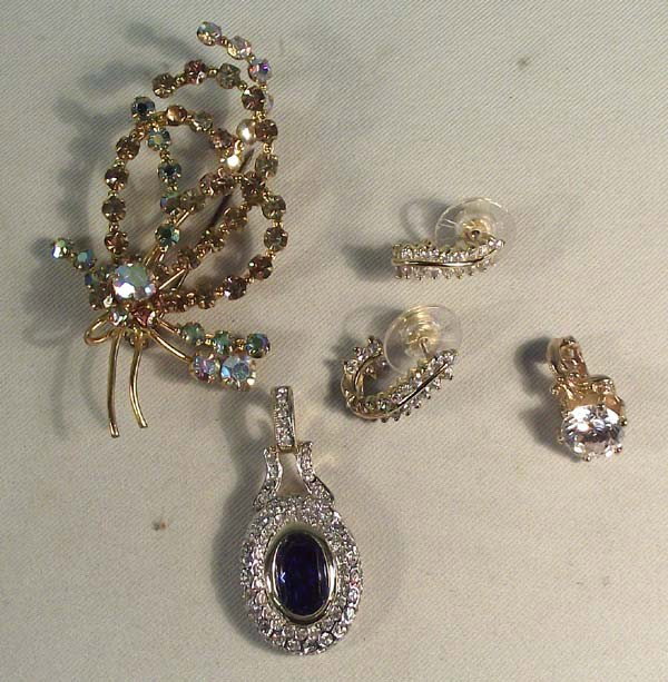 Jewelry Collection - Pin, Earrings & Two Pendants: Jewelry Collection - Pin, Earrings & Two Pendants. Pin is set with aurora borealis crystals, gold-tone setting, 2 3/4'' long, 1 1/2'' wide. Snap-on pendant, gold-tone with center zircon stone 3/8'' di