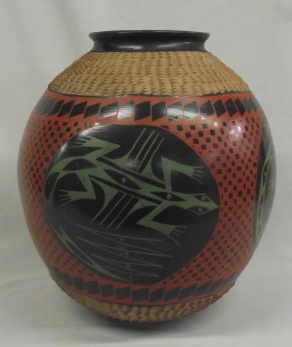 Mata Ortiz Museum Size Lizard Jar - Mario Luna: Mata Ortiz Museum Size Lizard Jar. Large jar, 12.5''Hx12''W, has 4 green lizards on black circles surrounding the jar. Red and black geometric designs around the lizard and textured borders on rim and