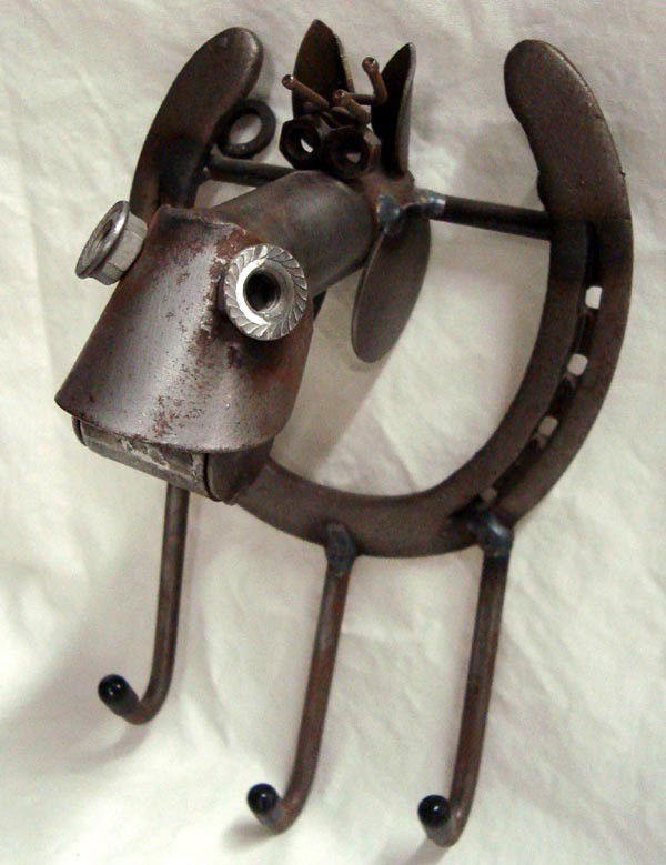 Cowboy Horseshoe, Welded Horse Head Metal Folk Art: Cowboy Horseshoe, Welded Horse Head Metal Folk Art. 8.5''H x 5.5''L x 4.5'' D. Three hooks for hanging clothes, keys or barn items. Two hanger rings on back for wall mounting. Various metal hardware p