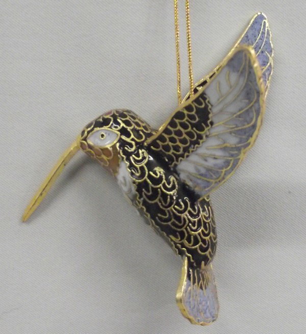 Handmade Cloisonne Enamel Hummingbird: Handmade Cloisonne Enamel Hummingbird. Delightful, colorful hummingbird ready to hang on your Christmas tree or in your window. Made in China. Measures 3.5''Lx2.5''W.