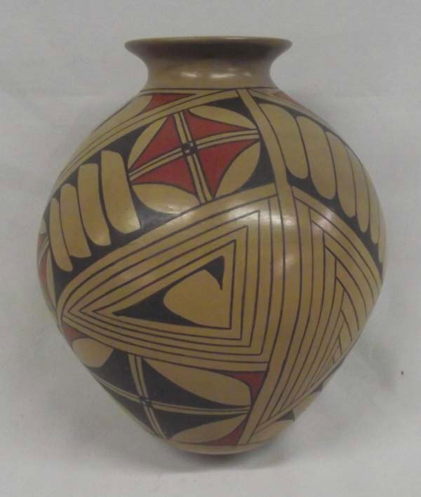 Mata Ortiz Polychrome Pottery Jar - Bugarini: Mata Ortiz Polychrome Pottery Bowl - Bugarini. Stylized feather design around the jar. Signed on the bottom Cesar L. Bugarini. Measures 8.5''Hx7''W.