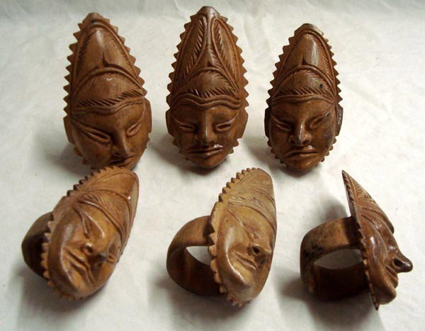 Carved Wooden Peruvian Head Napkin Rings: Carved Wooden Peruvian Head Napkin Rings. Set of 6. Approx. 4.5''H x 1.75'' L. Used and show wear but intact. Interesting faces and nicely carved.