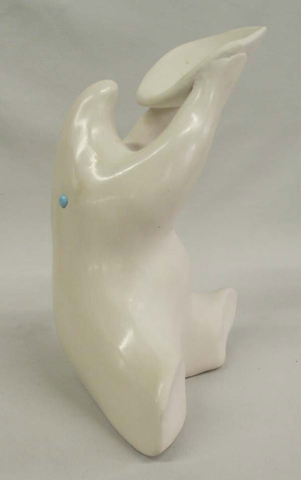 1995 Pottery Polar Bear Sculpture - Ramirez: 1995 Pottery Polar Bear Sculpture by artist Andrew Ramirez. Pure white stylized polar bear holding offering plate. Signature on bottom and dated 1995. Measures 6.75''H x5.25''W x 3.25''D.