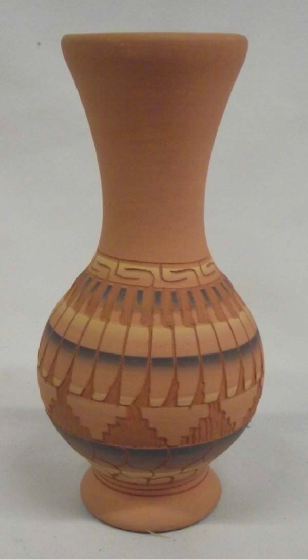 Navajo Etched Vase - Vera T: Native American Navajo Etched Vase - Vera T. Etched design on light red vase. Signed on the bottom, ''Vera T Navajo.'' Measures 5''Hx2.5''W.
