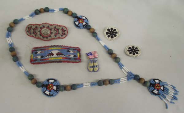 Sioux Beadwork Barrettes, Earrings, Pin, Necklace: Native American Sioux Beadwork Barrettes, Earrings, Pin, Necklace. 2 lovely barretts on leather backing; one with concho in center; the largest is 4.25''L. The round earrings are 1.5'' diameter. The n