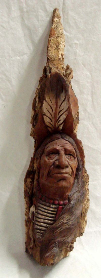 Wood Carving of Warrior ''Many Faces''-John Burke: Wood Carving Native American Warrior. ''Many Horses'' artist John Burke carved this from one piece of wood 18.25''H x 4.5''W. Hallmarked. Stands alone or has wall hanger.