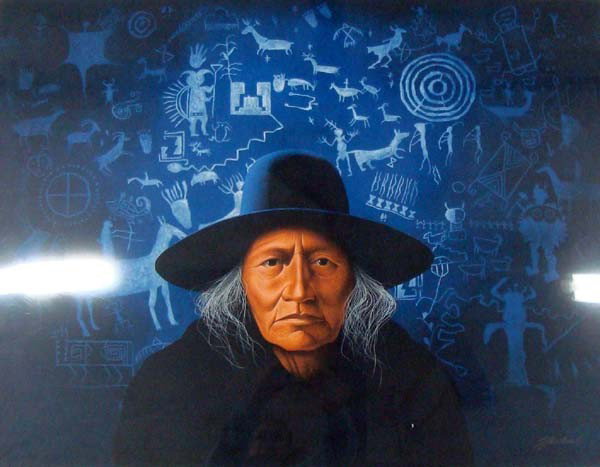 ''Blue Petroglyphs and Navajo Man'' Serigraph-Howell: ''Blue Petroglyphs and Navajo Man'' Serigraph by Frank Howell. A well-known Southwest painter, print-maker and gallery owner in Santa Fe, New Mexico. Print is signed and large, measuring 30.5''H x 39'