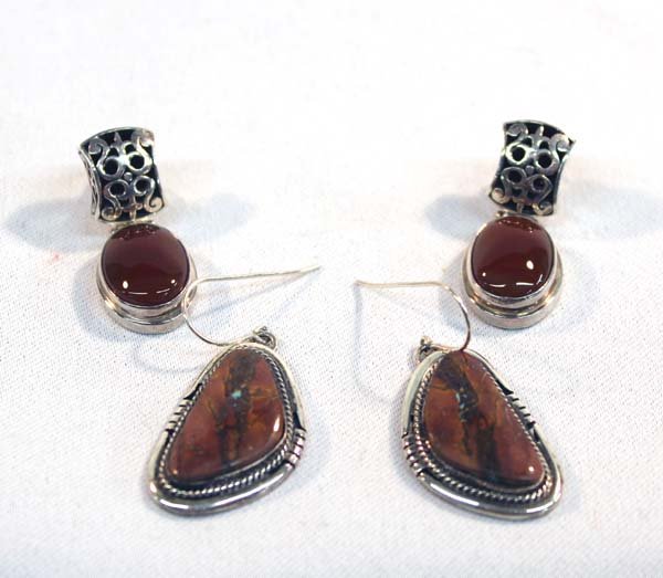 2 Pair Sterling Silver Pierced Earrings: 2 Pair Sterling Silver Pierced Earrings. Sterling Carnelian and silver cutout work earrings. From Bali, Indonesia, measure approx. 1 1/2''L cabochon measures approx. 1/2'' x 3/4''. Sterling silver Bou