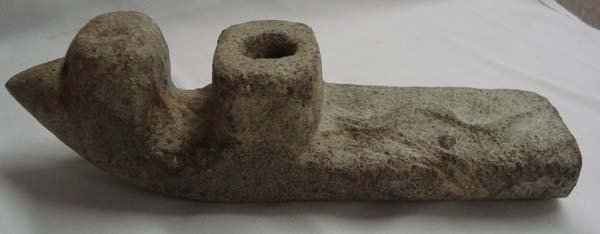 Bird Effigy Snake Stone Pipe: Bird Effigy Snake Stone Pipe, measures approx. 9.25''L x 2.25''W x 2.25''H. There is a snake running up the handle and the bowl of there is a bird head carved in front of the bowl of the pipe. Age & O