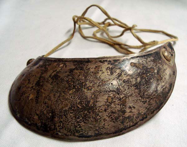 French Trade Silver Gorget Strung on String: French Trade Silver Gorget strung on String. Silver test not run on this item. Dugin Lee Co., Miss. Age & Origin Unknown. Measures approx.4.25''L x 2''W.