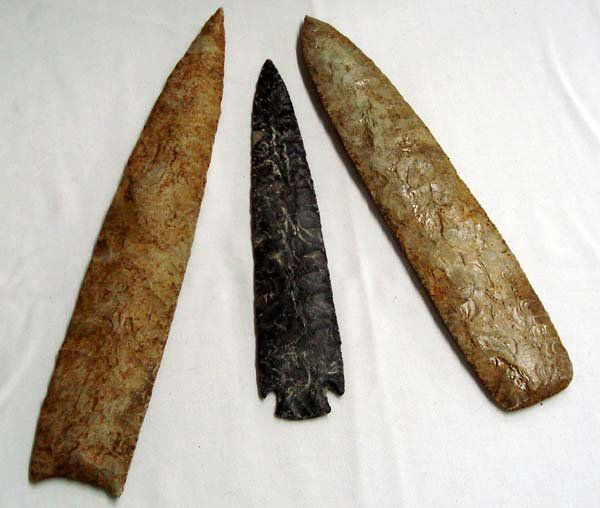 Stone Spear Lance Heads: Stone Spear Lance Heads, largest measures approx. 15.25L x 3.75''W, smallest 11''L x 2.25''W. For hunting large buffalo, these spear heads come in a variety of colored stones and sizes. Age & Origin U