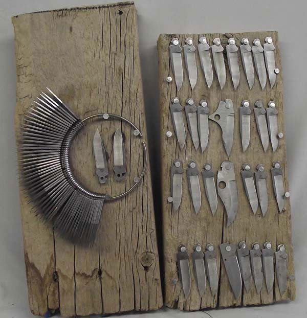 Large Collection of Buck Pocket Knife Blades: Large Collection of Buck Pocket Knife Blades. Two solid pieces of wood with knife blade collections displayed. One has 30 blades secured to the wood with nails. All have the brand name ''Buck'' showin