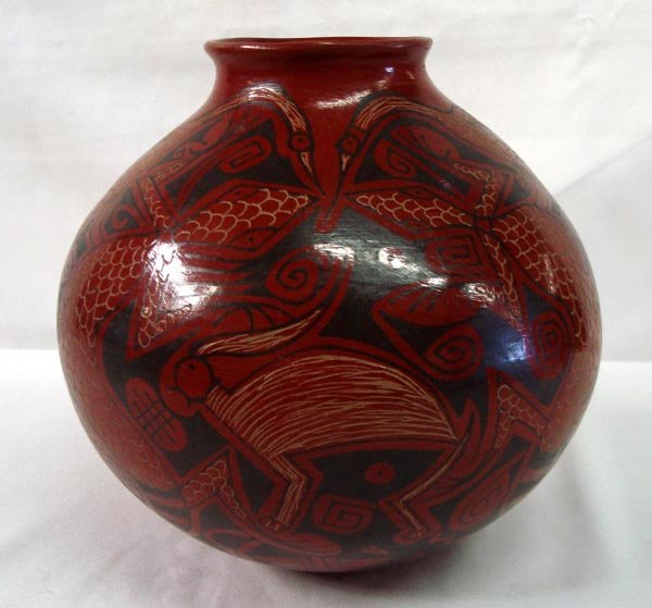 Mata Ortiz Rabbit, Lizard, Bird Polychrome Jar: Mata Ortiz Rabbit, Lizard, Bird Polychrome Jar. Red, black and cream colors. Signed on the bottom, ''Daniel Gonzalez'' Approx 7.5''Hx 8.5'' diameter. A very pretty piece.