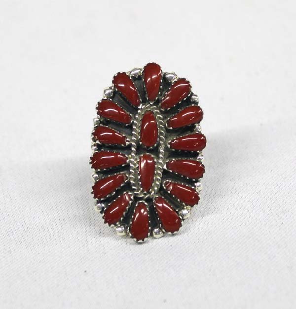 Navajo Sterling & Coral Cluster Ring by Williams: Native American Navajo Sterling & Coral Cluster Ring by Juliana Williams (JW), 16 tear drop shaped blood red coral stones create the cluster design of this ring, the two center stones are encased by a