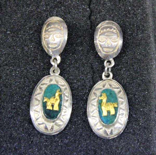 South American Sterling Silver Llama Post Earrings: South American Sterling Silver Llama Post Earrings, gold leaf llama sits atop green oval cabochon, stamping on both sides of earrings and there is a mask stamped on top post piece, back of earrings st