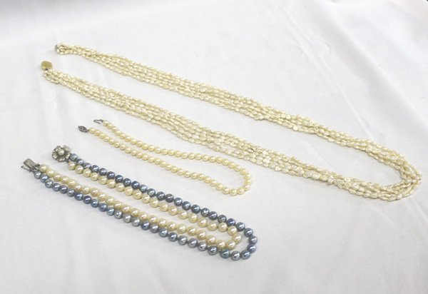 Pearl Necklaces One With Gold Clasp: 3 Pearl Necklaces One With Gold Clasp. The 5 strand seed pearl necklace has a 14kt gold clasp. It measures 32'' end to end. The blue and white pearl choker measures 16'' end to end. The small pearl ch