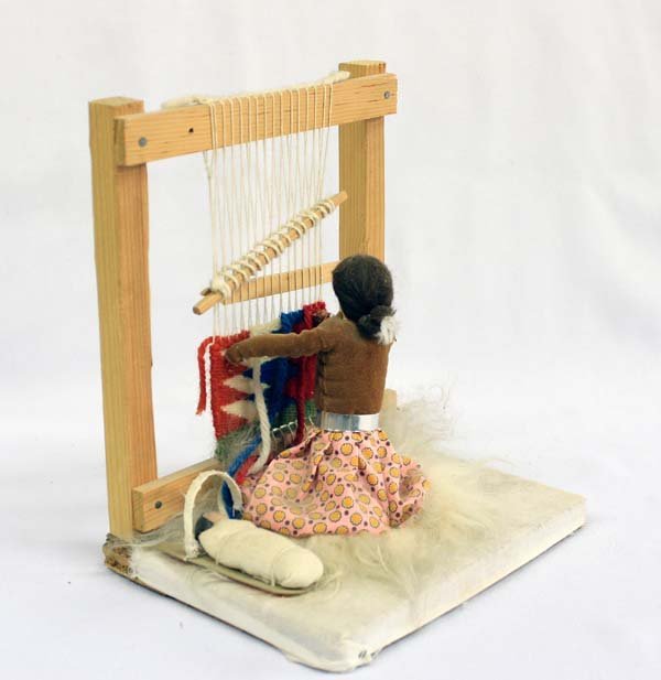 Navajo Weaver Doll and Loom - 2 pcs.: Native American Navajo Weaver Doll weaving at loom with partial red-white-turquoise rug sitting on lamb's wool and large beautiful loom with partial maroon-light and dark gray--black-white rug and too