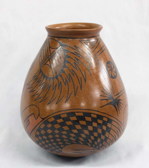 Mata Ortiz Jar by Tito Enriquez: Mata Ortiz Jar by Tito Enriquez, black geometric and zoomorphic designs cover a reddish brown jar, some light red accent paint, measures approx. 8.75''H x 7.25''D