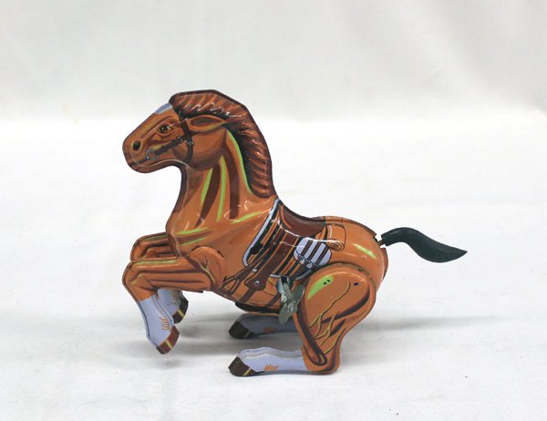 Vintage Korean Tin Wind Up Toy Horse: Vintage Korean Tin Wind Up Toy Horse, does work, however missing it's Indian Rider, good condition, measures approx. 2'' x 5.5'' x 7.5''