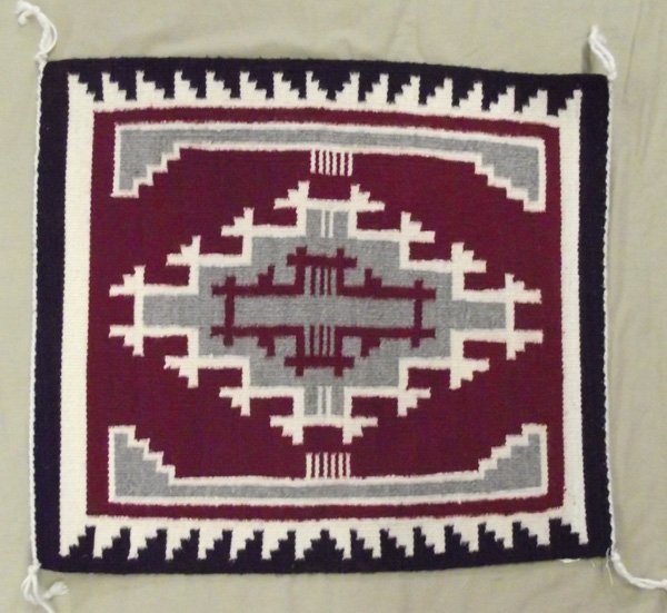 Navajo Ganado Rug - Jane Curley: Navajo Native American Ganado Rug - Jane Curley. Geometric Ganado weaving in crimson red, gray, white and black. Fine weaving by Jane Curley. Measures 19''x22.5''.