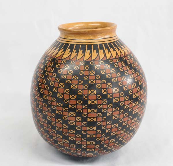 Mata Ortiz by Tito Enriquez: Mata Ortiz by Tito Enriquez, stylized feathers encircle neck of jar and fine line eye dazzler designs blankets the remaining pot, very detailed and intricate, hues of brown, buff, tan, and black, meas