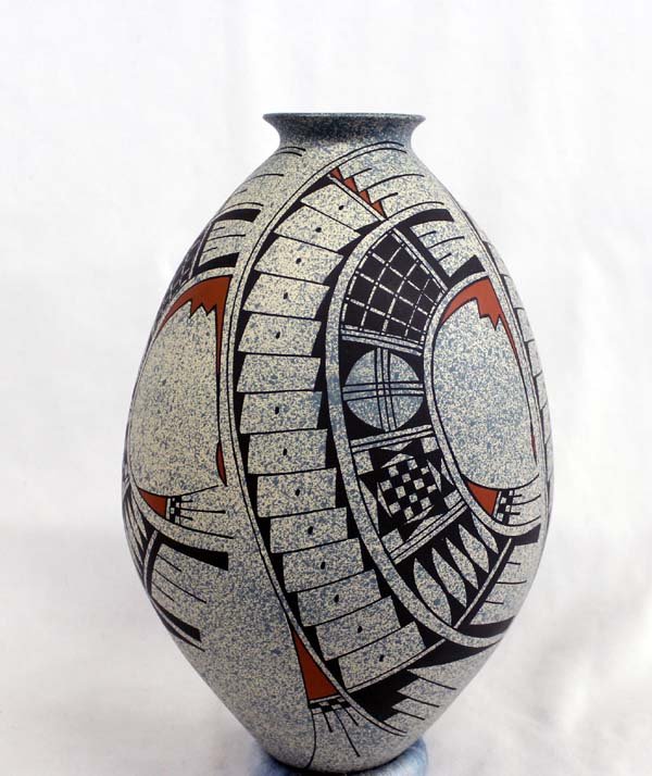 Mata Ortiz Pottery by Jose' Villa Ortiz: Mata Ortiz Pottery by Jose Villa Ortiz, very unique piece base coat of pot is spatter painted in a steel blue paint over a cream colored pot, very intricate geometric designs cover jar in hues of blac