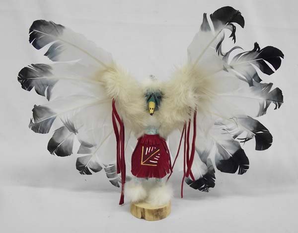 Navajo Eagle Kachina by F. Charley: Native American Navajo Eagle Kachina by F. Charley, signed and numbered (125107) Navajo on bottom, beautiful fanned out feathers, kachina is wearing a red suede fringed skirt with geometric red, yello