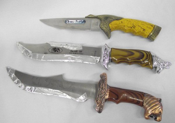 Collection of Knives: Collection of Knives, 3 Fantasy Knives to include (a)''Bear of the North Pole'' by Habib, stainless with dog or wolf head on hilt, (b) has brass duck on handle and is marked Rostfrei Stainless, and ha