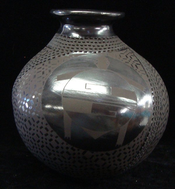Mata Ortiz Black on Black Jar - Benjamin Soto: Mata Ortiz Black on Black Jar - Benjamin Soto. Texturing and fine geometric designs. Also three large circles with turtle figures surround the body of the jar. Measures 7.5''Hx7''W. Signed on the bott