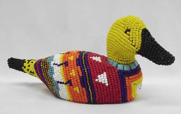 Hand Beaded Wooden Duck-Kills Thunder: Hand Beaded Wooden Duck by Kills Thunder. Beaded by hand in bold colors traditional of artist Kills Thunder, this duck will put a smile on your face and brighten up any corner. 5''H x 10''L x 4''W.