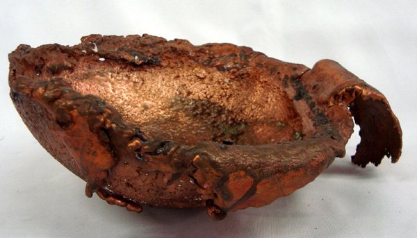 New Mexico Native Large Copper Splash Bowl: Large Copper Splash Bowl. Copper bowls are derived from the pouring of flat pieces of splash copper. The copper is poured from a furnace into a ladle the shape of a large bowl. The copper is then pour