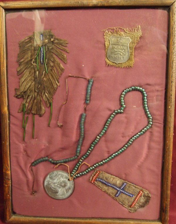 Native American Beadwork Plus Collectibles, Framed: Native American Beadwork Plus Collectibles, Framed. Collection includes beadwork, peace medal, Indian/Police Badge, all pieces age unknown. Interesting collection. Piece measures 16'' x 21''.