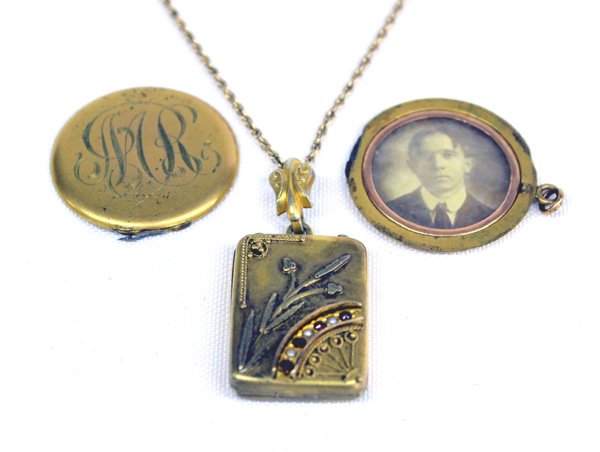 Antique Estate Gold Lockets: Pr of Antique Estate Gold Lockets. One locket's hinge is broken. These have been in the Urban family for many years. One has gold chain. Lockets measures approx. 1'' round and the other is 1 x .75'' a