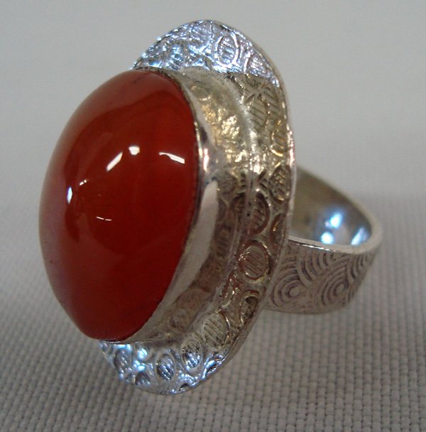 Carnelian Sterling Silver Ring Size 7.25: Sterling Carnelian Cabochon Ring with etched shank. marked 925. Cabochon = 3/4'' x 5/8''. Ring is a Sz 7.3/4.