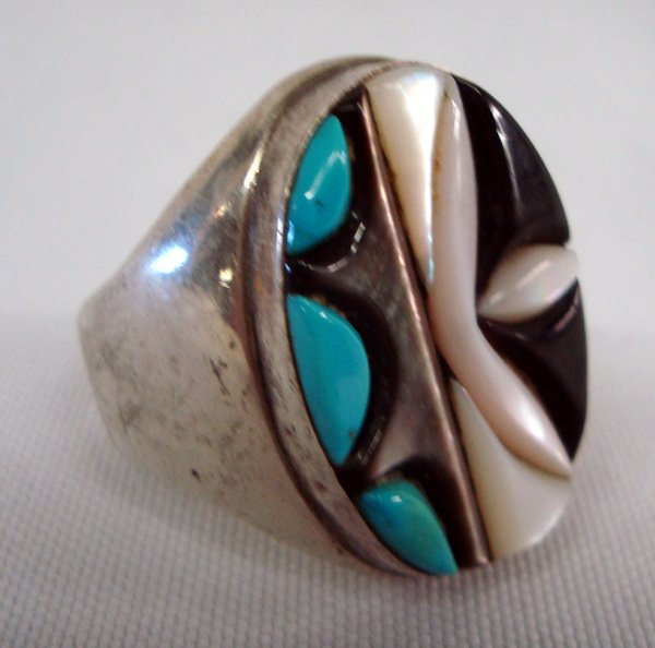 Zuni Stone-to Stone Inlay Ring - Malini: Zuni Stone-to Stone Inlay Ring. Nice heavy ring, Jet, Abalone, Mother of Pearl, Turquoise. Hallmarked LM Lolita Malini. Sz 2.25. 1 1/8'' L x .75'' W.