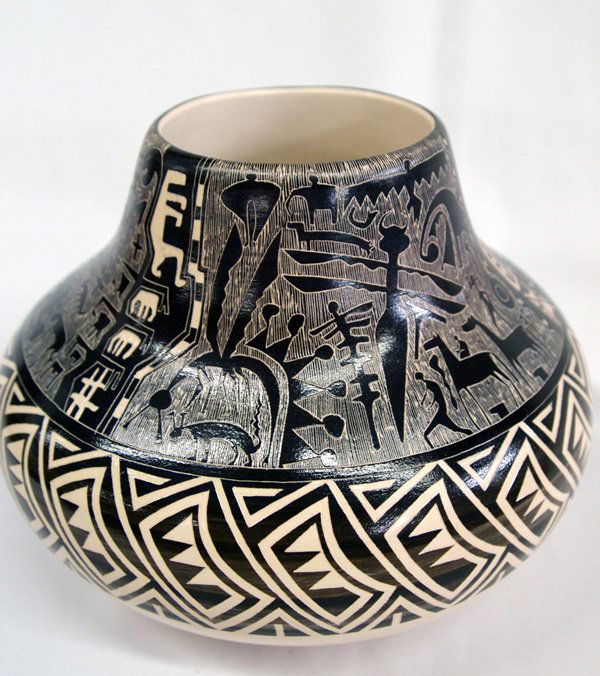 Native American Pottery by N. Tansing: Native American Pottery by N. Tansing, buff color with black and brown petroglyph and geometric designs. Signed on bottom N. Tansing ''South Wind Flight'' and a buffalo hallmark. Measures 7'' W x 5 1/