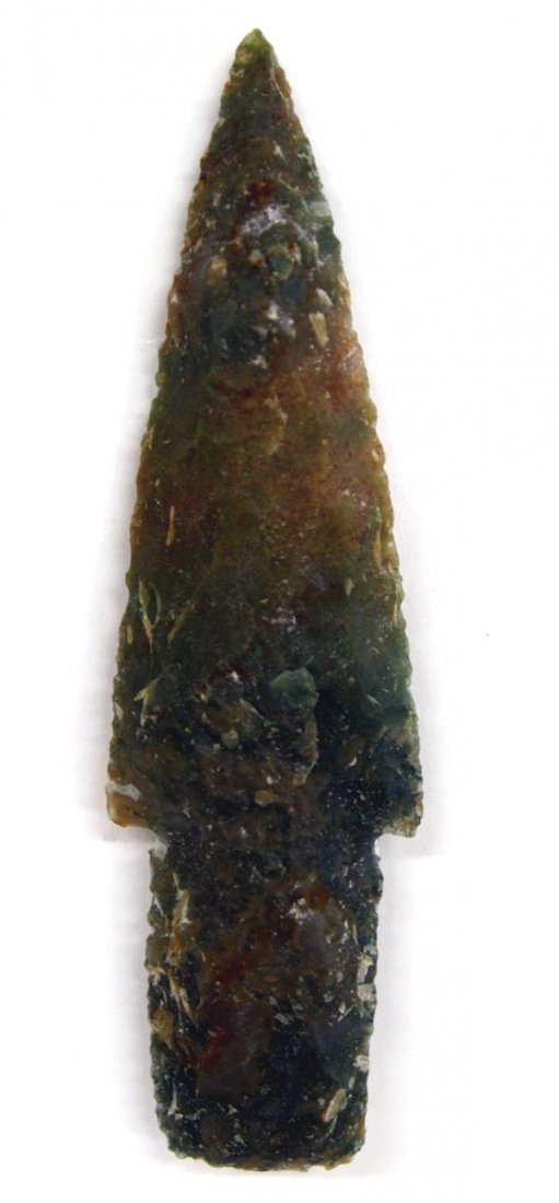Stone Spearhead: Stone Spearhead, black and brown in color. Age and origin unknown. Measures 4 1/4'' L x 1 1/4'' W.