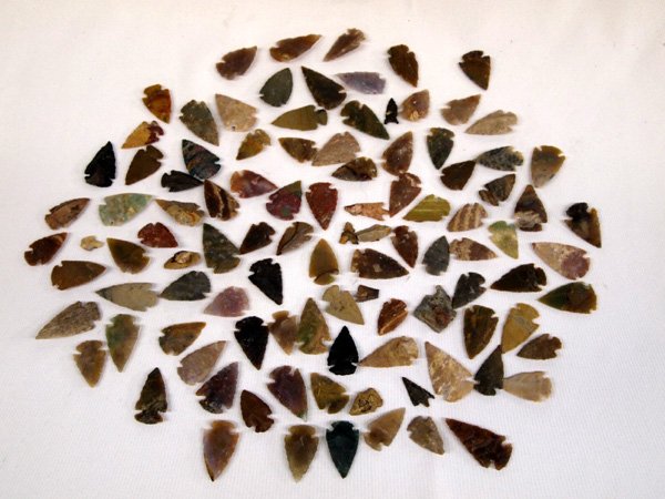 Stone Arrowheads: Stone Arrowheads, large collection, various colors. Age and origin unknown. App.. measurement of largest is 1 1/2'' l.