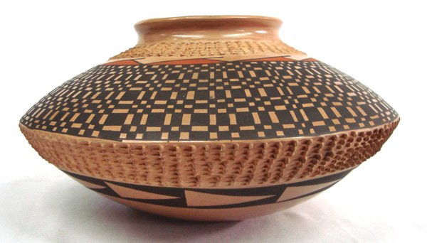 Mata Ortiz Geometric Pottery Jar - Mario Olivas: Mata Ortiz Pottery Bowl - Mario Olivas. Polychrome flying saucer shaped bowl with geometric designs around top half and horizontal triangles on the bottom half. Fingernail pushed textured rows around 