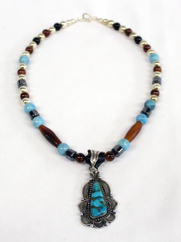 Navajo Sterling Turquoise Necklace - Martinez: Native American Navajo Sterling Silver Kingman Turquoise Pendant Necklace by Richard Martinez. Beads are designed by Navajo artist Mary Plummer. Necklace measures approx 16'' end to end. Pendant measu