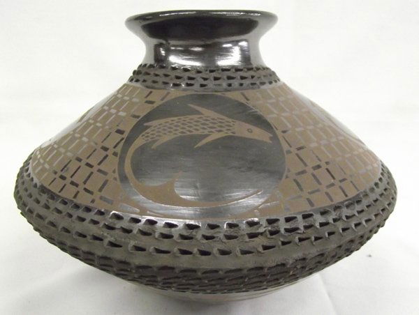 Mata Ortiz Burnished Pot, Fish Design by Soto: Mata Ortiz Burnished Pot, Fish Design by Benjamin Soto. The bottom of the pot is geometrical and will look nice on a high shelf. 6''H x 8'' diameter.