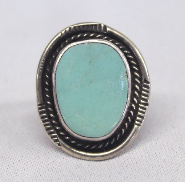 Navajo Pawn Nevada Green Turquoise Ring: Native American Navajo Pawn Nevada Green Turquoise Ring. Smooth robin egg blue set in a twisted rope design surrounding the base. Size 8.75''. Cabochon is 1.5''H x 1''W.