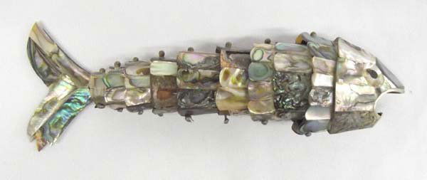 Mexican Abalone Jointed Fish Bottle Opener: Mexican Abalone Jointed Fish Bottle Opener, beautiful inlay abalone shell on copper make up the scales on this fish, missing some scales, measures approx. 8'' x 2''.