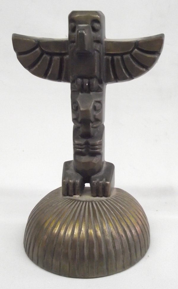 Brass Totem Pole by Cygnus Inc. Edmonds, WA: Brass Totem Pole by Cygnus Inc. Edmonds, WA, very heavy, green felt protector on bottom, totem is sitting on scalloped base, measures approx. 6.25''H x 3.75'' x 2.5''.