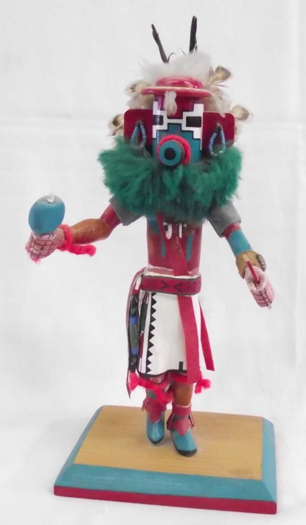 ''Snow'' Kachina on wooden Base: ''Snow'' Kachina on wooden Base signed. 11.75''H x 6''W. Colorful and full of detail like beaded earrings and fetish necklace. Colorful and well designed.