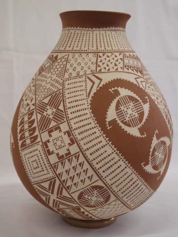 Mata Ortiz Large Jar- Jesus M. Rodriguez: Mata Ortiz Large Jar- Jesus M. Rodriguez. This exquisite painted jar resembles lace in a Mexican design. If you like pottery, this is a must have! 11''H x 9.75'' diameter.