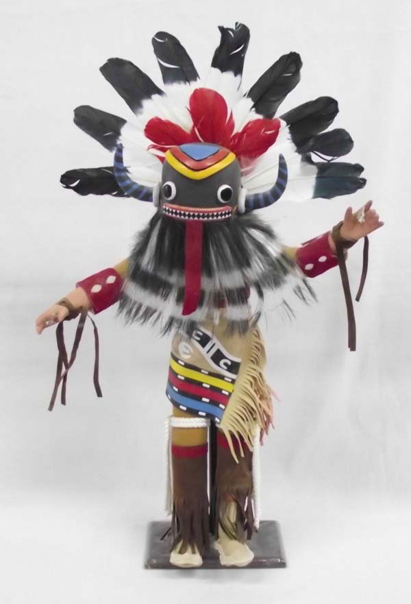 Old Style Long Haired Kachina by Al Foote: Old Style Long Haired Kachina by Al Foote 21.5''H x 12.5''W. He is missing items from his hands. The base is covered in plastic for protection. Kachinas are costumed, feathered dolls and used as learn