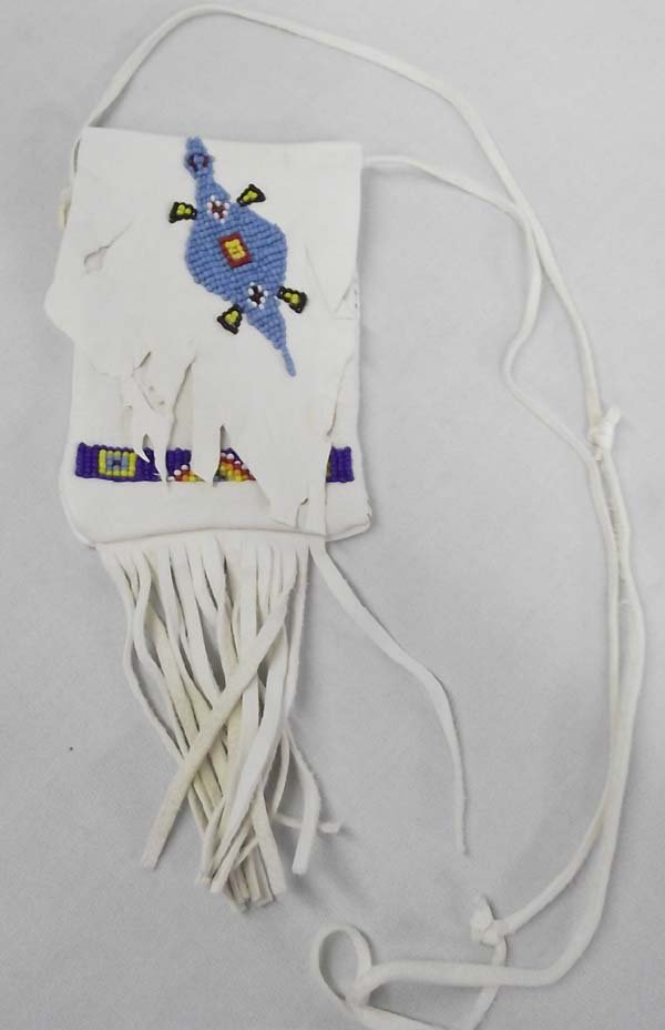 Sioux Leather Beaded Shoulder Bag by Doug Fast: Native American Sioux Leather Beaded Shoulder Bag - Doug Fast. Lovely ivory colored deerskin bag with beadwork by Doug Fast. Fringed strips on the bottom and a leather shoulder strap. Measures 6.25''L